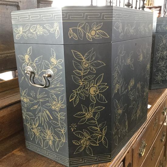 A pair of Chinese black lacquer gilt decorated elongated octagonal shaped boxes(-)